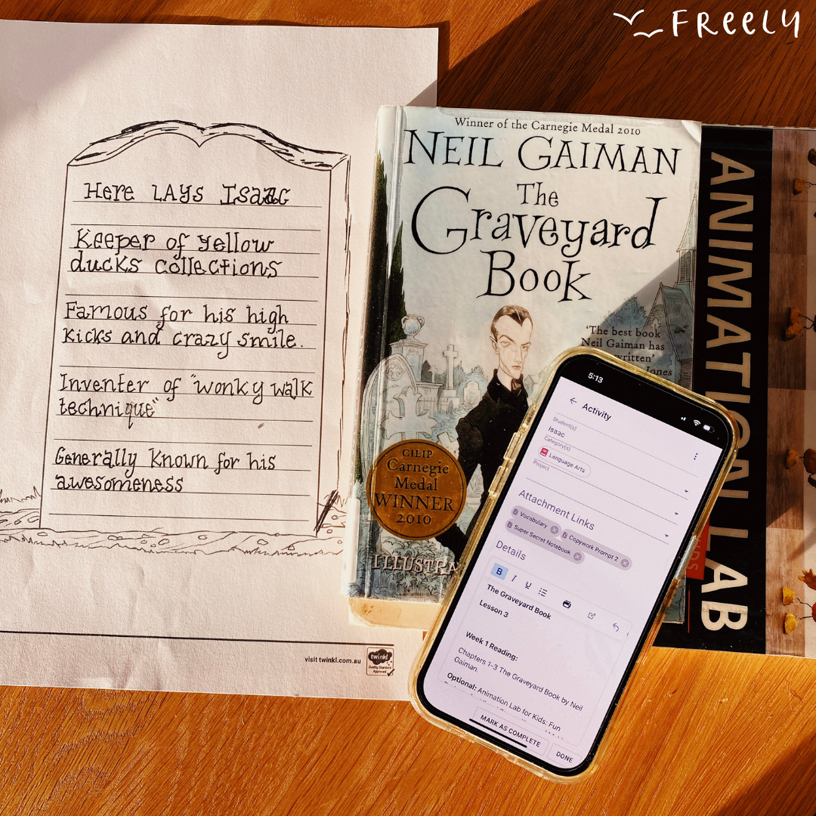 A novel called the graveyard book and Freely online homeschool planner app open on a phone